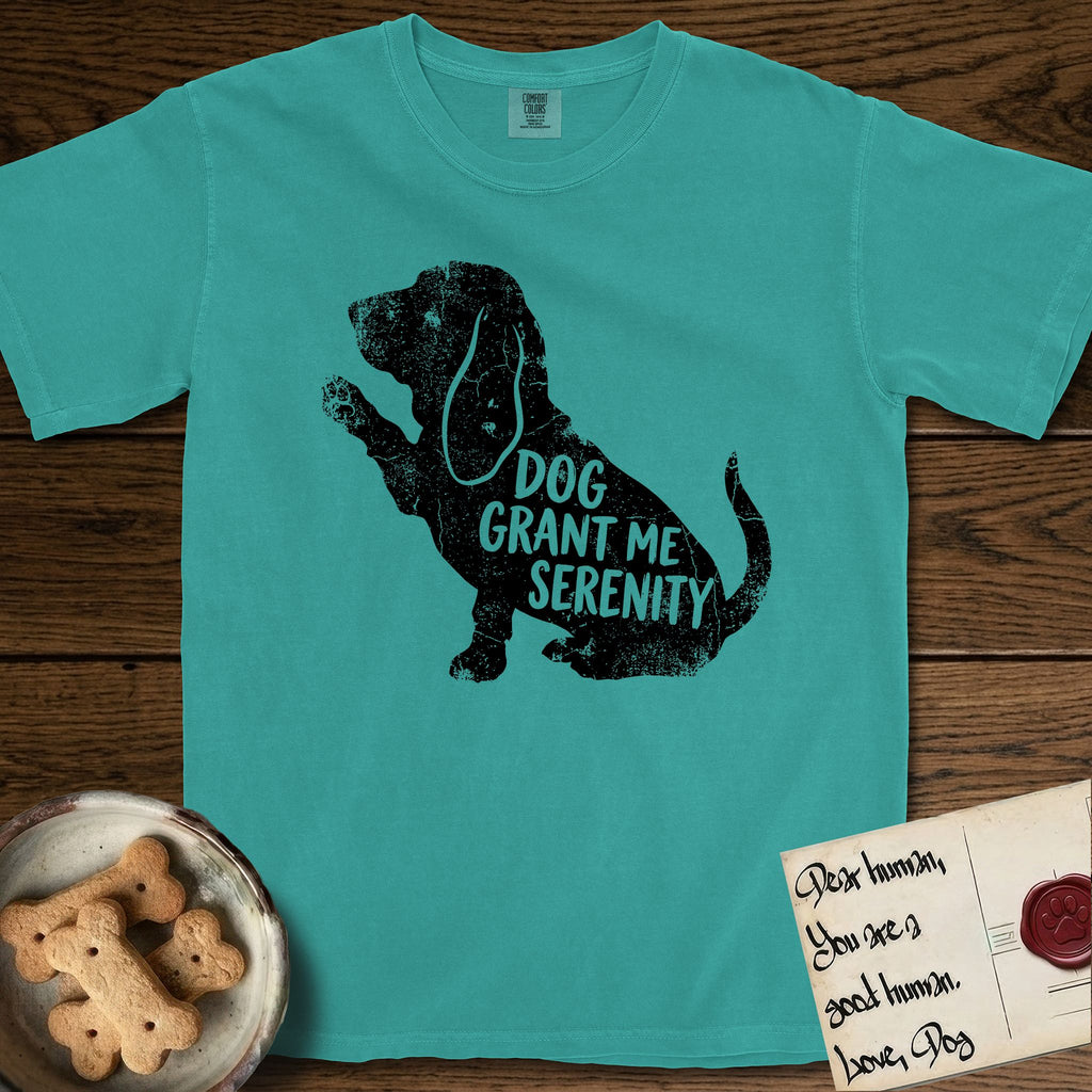 Serenity Basset Hound T-Shirt flat lay in Seafoam, featuring Distressed black screen print silhouette of a Basset Hound sitting in profile with one paw raised and long ears hanging, the words DOG GRANT ME SERENITY showing through his body in the shirt color.