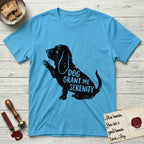 Serenity Basset Hound T-Shirt flat lay in Sky, featuring Distressed black screen print silhouette of a Basset Hound sitting in profile with one paw raised and long ears hanging, the words DOG GRANT ME SERENITY showing through his body in the shirt color.