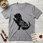 Serenity Basset Hound T-Shirt flat lay in Sport Grey, featuring Distressed black screen print silhouette of a Basset Hound sitting in profile with one paw raised and long ears hanging, the words DOG GRANT ME SERENITY showing through his body in the shirt color.