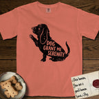 Serenity Basset Hound T-Shirt flat lay in Terracotta, featuring Distressed black screen print silhouette of a Basset Hound sitting in profile with one paw raised and long ears hanging, the words DOG GRANT ME SERENITY showing through his body in the shirt color.