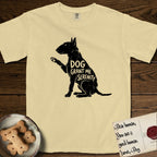 Serenity Bull Terrier T-Shirt flat lay in Butter, featuring Distressed black screen print silhouette of a Bull Terrier sitting in profile with one paw raised and an egg-shaped head, the words DOG GRANT ME SERENITY showing through her body in the shirt color.