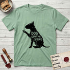 Serenity Bull Terrier T-Shirt flat lay in Mint Green, featuring Distressed black screen print silhouette of a Bull Terrier sitting in profile with one paw raised and an egg-shaped head, the words DOG GRANT ME SERENITY showing through her body in the shirt color.