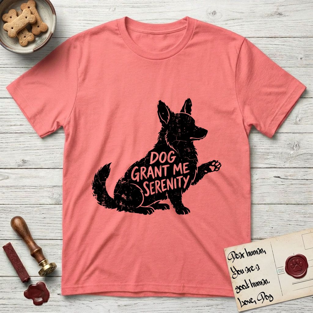 Serenity Corgi T-Shirt flat lay in Coral Silk, featuring Distressed black screen print silhouette of a Corgi sitting in profile with one paw raised, upright ears and a full brush tail, the words DOG GRANT ME SERENITY showing through his body in the shirt color.