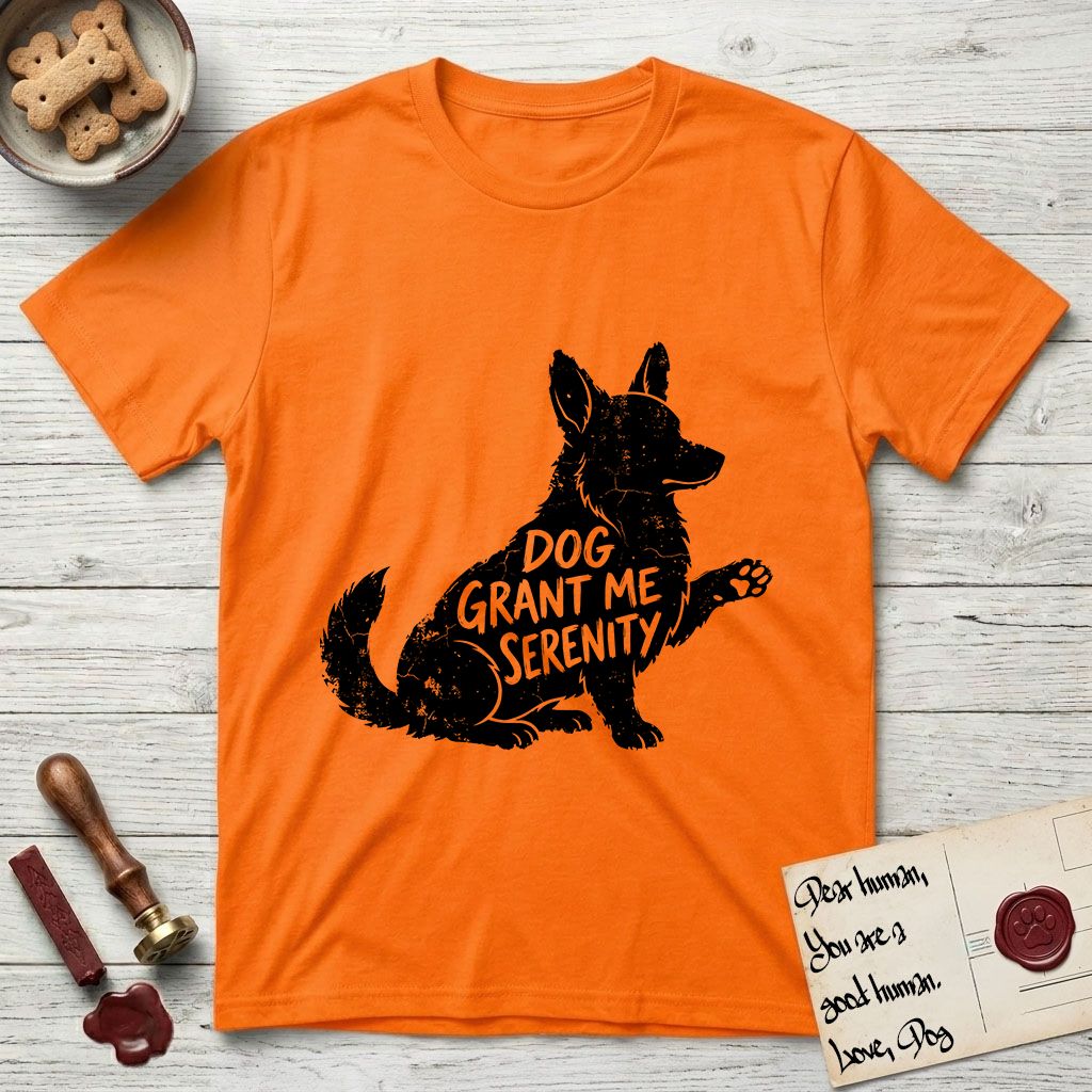 Serenity Corgi T-Shirt flat lay in Orange, featuring Distressed black screen print silhouette of a Corgi sitting in profile with one paw raised, upright ears and a full brush tail, the words DOG GRANT ME SERENITY showing through his body in the shirt color.