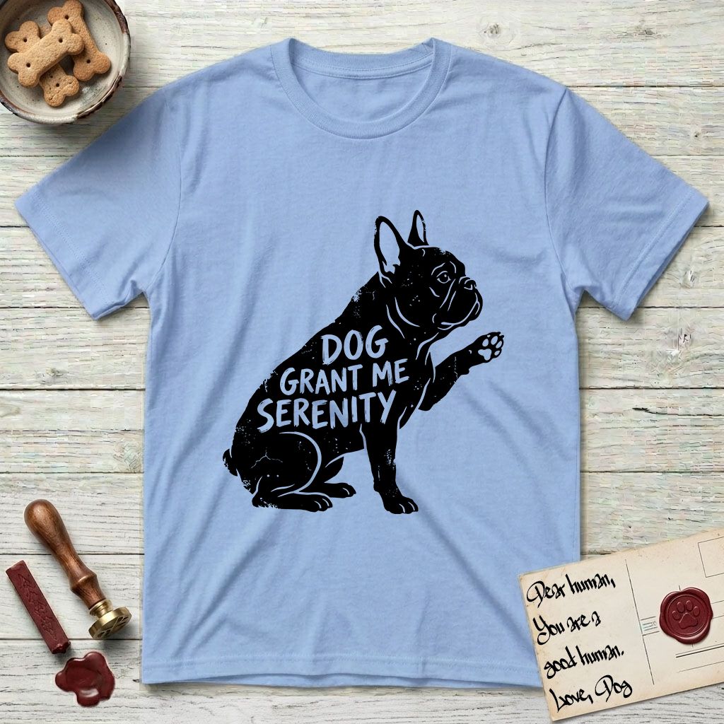 Serenity French Bulldog T-Shirt flat lay in Light Blue, featuring Distressed black screen print silhouette of a French Bulldog sitting in profile with one paw raised and large upright bat ears, the words DOG GRANT ME SERENITY showing through his body in the shirt color.