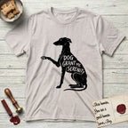 Serenity Greyhound T-Shirt flat lay in Ice Grey, featuring Distressed black screen print silhouette of a Greyhound sitting in profile with one paw raised, an arched back and a long whip tail, the words DOG GRANT ME SERENITY showing through her body in the shirt color.