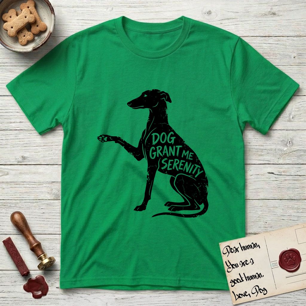 Serenity Greyhound T-Shirt flat lay in Irish Green, featuring Distressed black screen print silhouette of a Greyhound sitting in profile with one paw raised, an arched back and a long whip tail, the words DOG GRANT ME SERENITY showing through her body in the shirt color.