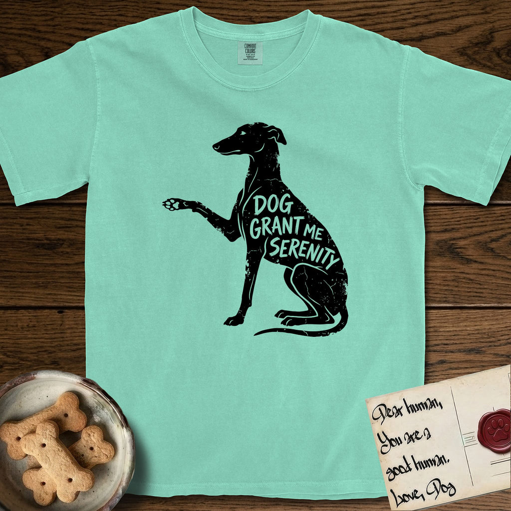 Serenity Greyhound T-Shirt flat lay in Island Reef, featuring Distressed black screen print silhouette of a Greyhound sitting in profile with one paw raised, an arched back and a long whip tail, the words DOG GRANT ME SERENITY showing through her body in the shirt color.