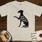 Serenity Greyhound T-Shirt flat lay in Ivory, featuring Distressed black screen print silhouette of a Greyhound sitting in profile with one paw raised, an arched back and a long whip tail, the words DOG GRANT ME SERENITY showing through her body in the shirt color.