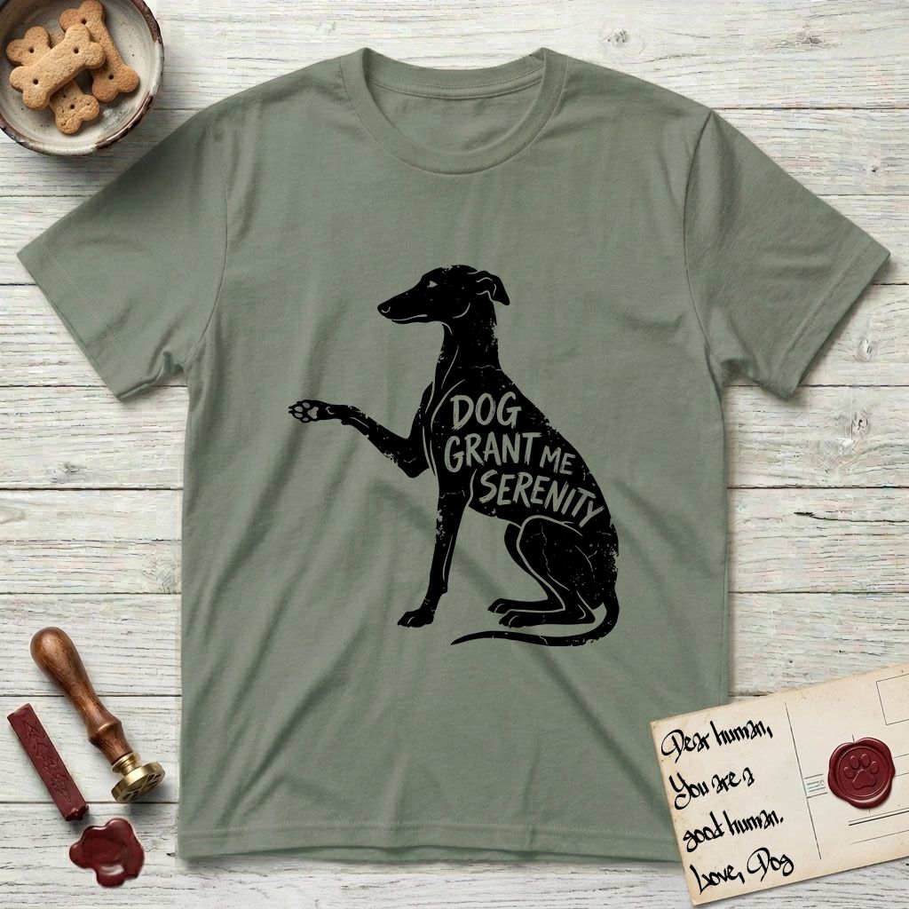 Serenity Greyhound T-Shirt flat lay in Sage, featuring Distressed black screen print silhouette of a Greyhound sitting in profile with one paw raised, an arched back and a long whip tail, the words DOG GRANT ME SERENITY showing through her body in the shirt color.