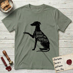 Serenity Greyhound T-Shirt flat lay in Sage, featuring Distressed black screen print silhouette of a Greyhound sitting in profile with one paw raised, an arched back and a long whip tail, the words DOG GRANT ME SERENITY showing through her body in the shirt color.