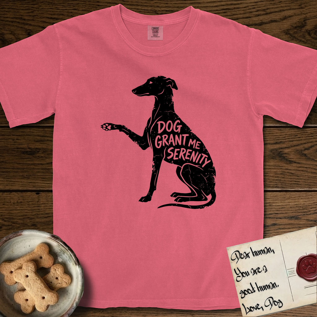Serenity Greyhound T-Shirt flat lay in Watermelon, featuring Distressed black screen print silhouette of a Greyhound sitting in profile with one paw raised, an arched back and a long whip tail, the words DOG GRANT ME SERENITY showing through her body in the shirt color.