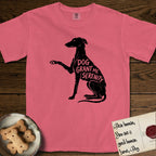 Serenity Greyhound T-Shirt flat lay in Watermelon, featuring Distressed black screen print silhouette of a Greyhound sitting in profile with one paw raised, an arched back and a long whip tail, the words DOG GRANT ME SERENITY showing through her body in the shirt color.