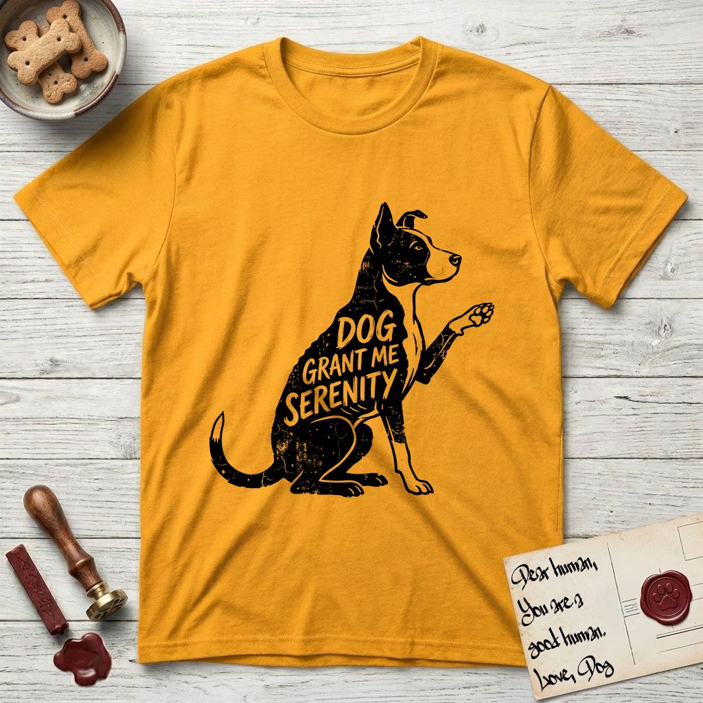 Serenity Lobo T-Shirt flat lay in Gold, featuring Distressed black screen print silhouette of a black and white Cattle Dog and Pitbull mix sitting in profile with one paw raised, a white blaze, white chest and white tail tip, the words DOG GRANT ME SERENITY showing through his body in the shirt color.