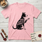 Serenity Lobo T-Shirt flat lay in Light Pink, featuring Distressed black screen print silhouette of a black and white Cattle Dog and Pitbull mix sitting in profile with one paw raised, a white blaze, white chest and white tail tip, the words DOG GRANT ME SERENITY showing through his body in the shirt color.