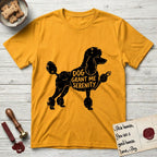 Serenity Poodle T-Shirt flat lay in Gold, featuring Distressed black screen print silhouette of a Poodle standing in profile with one paw raised, in a continental clip with a topknot and pompons, the words DOG GRANT ME SERENITY showing through her body in the shirt color.
