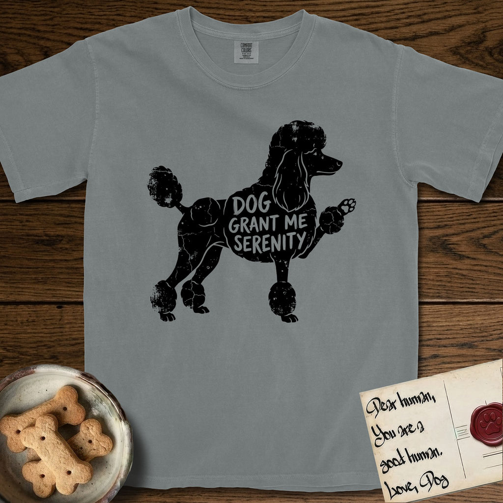 Serenity Poodle T-Shirt flat lay in Granite, featuring Distressed black screen print silhouette of a Poodle standing in profile with one paw raised, in a continental clip with a topknot and pompons, the words DOG GRANT ME SERENITY showing through her body in the shirt color.