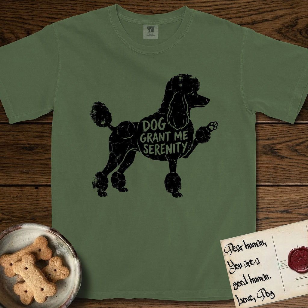 Serenity Poodle T-Shirt flat lay in Moss, featuring Distressed black screen print silhouette of a Poodle standing in profile with one paw raised, in a continental clip with a topknot and pompons, the words DOG GRANT ME SERENITY showing through her body in the shirt color.