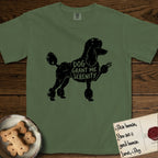 Serenity Poodle T-Shirt flat lay in Moss, featuring Distressed black screen print silhouette of a Poodle standing in profile with one paw raised, in a continental clip with a topknot and pompons, the words DOG GRANT ME SERENITY showing through her body in the shirt color.