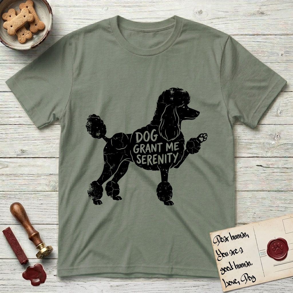Serenity Poodle T-Shirt flat lay in Sage, featuring Distressed black screen print silhouette of a Poodle standing in profile with one paw raised, in a continental clip with a topknot and pompons, the words DOG GRANT ME SERENITY showing through her body in the shirt color.