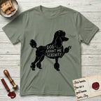Serenity Poodle T-Shirt flat lay in Sage, featuring Distressed black screen print silhouette of a Poodle standing in profile with one paw raised, in a continental clip with a topknot and pompons, the words DOG GRANT ME SERENITY showing through her body in the shirt color.