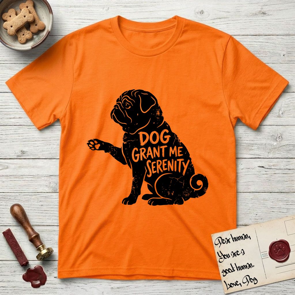 Serenity Pug T-Shirt flat lay in Orange, featuring Distressed black screen print silhouette of a Pug sitting in profile with one paw raised, a wrinkled face and a tightly curled tail, the words DOG GRANT ME SERENITY showing through his body in the shirt color.