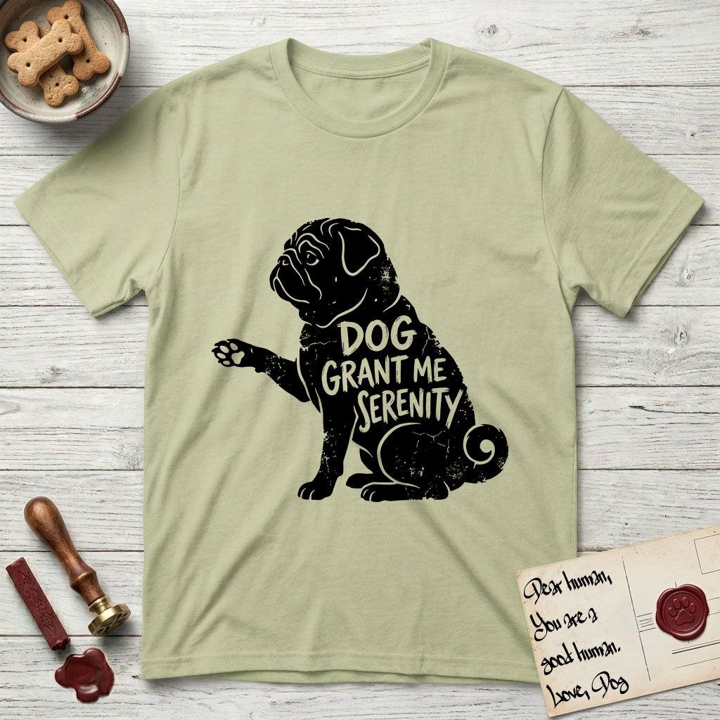 Serenity Pug T-Shirt flat lay in Pistachio, featuring Distressed black screen print silhouette of a Pug sitting in profile with one paw raised, a wrinkled face and a tightly curled tail, the words DOG GRANT ME SERENITY showing through his body in the shirt color.