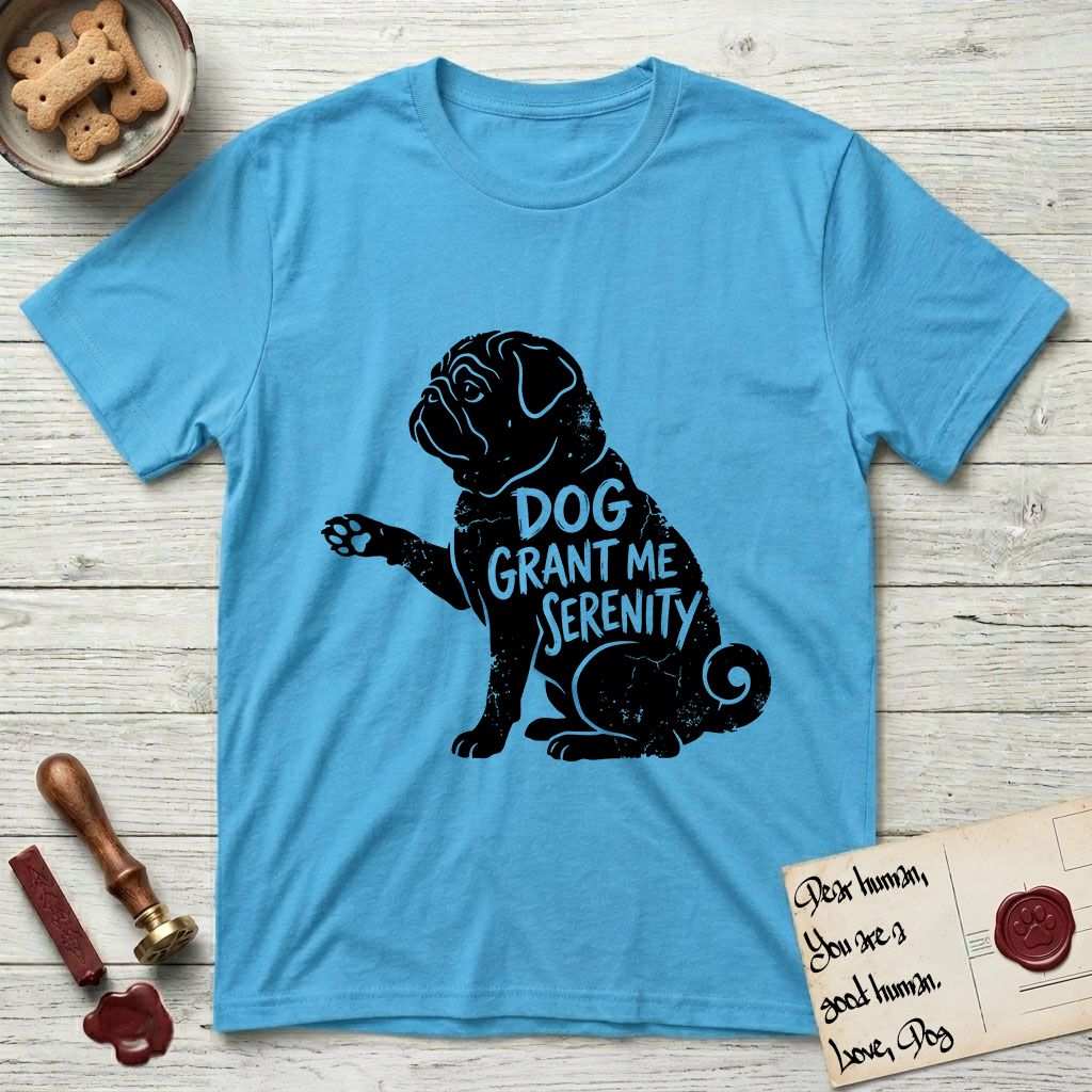 Serenity Pug T-Shirt flat lay in Sky, featuring Distressed black screen print silhouette of a Pug sitting in profile with one paw raised, a wrinkled face and a tightly curled tail, the words DOG GRANT ME SERENITY showing through his body in the shirt color.