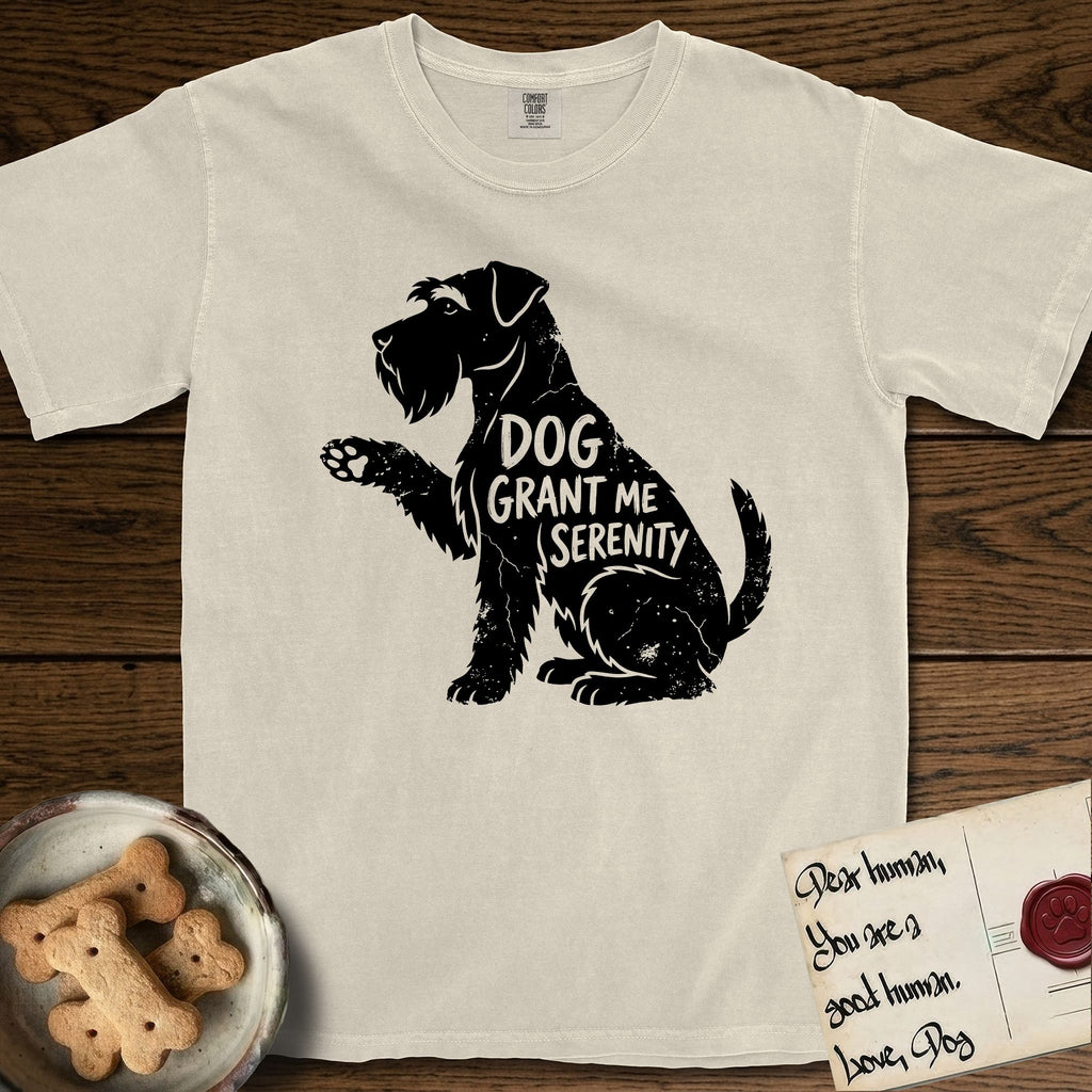 Serenity Schnauzer T-Shirt flat lay in Ivory, featuring Distressed black screen print silhouette of a Schnauzer sitting in profile with one paw raised, a long beard and bushy eyebrows, the words DOG GRANT ME SERENITY showing through her body in the shirt color.