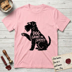 Serenity Schnauzer T-Shirt flat lay in Light Pink, featuring Distressed black screen print silhouette of a Schnauzer sitting in profile with one paw raised, a long beard and bushy eyebrows, the words DOG GRANT ME SERENITY showing through her body in the shirt color.