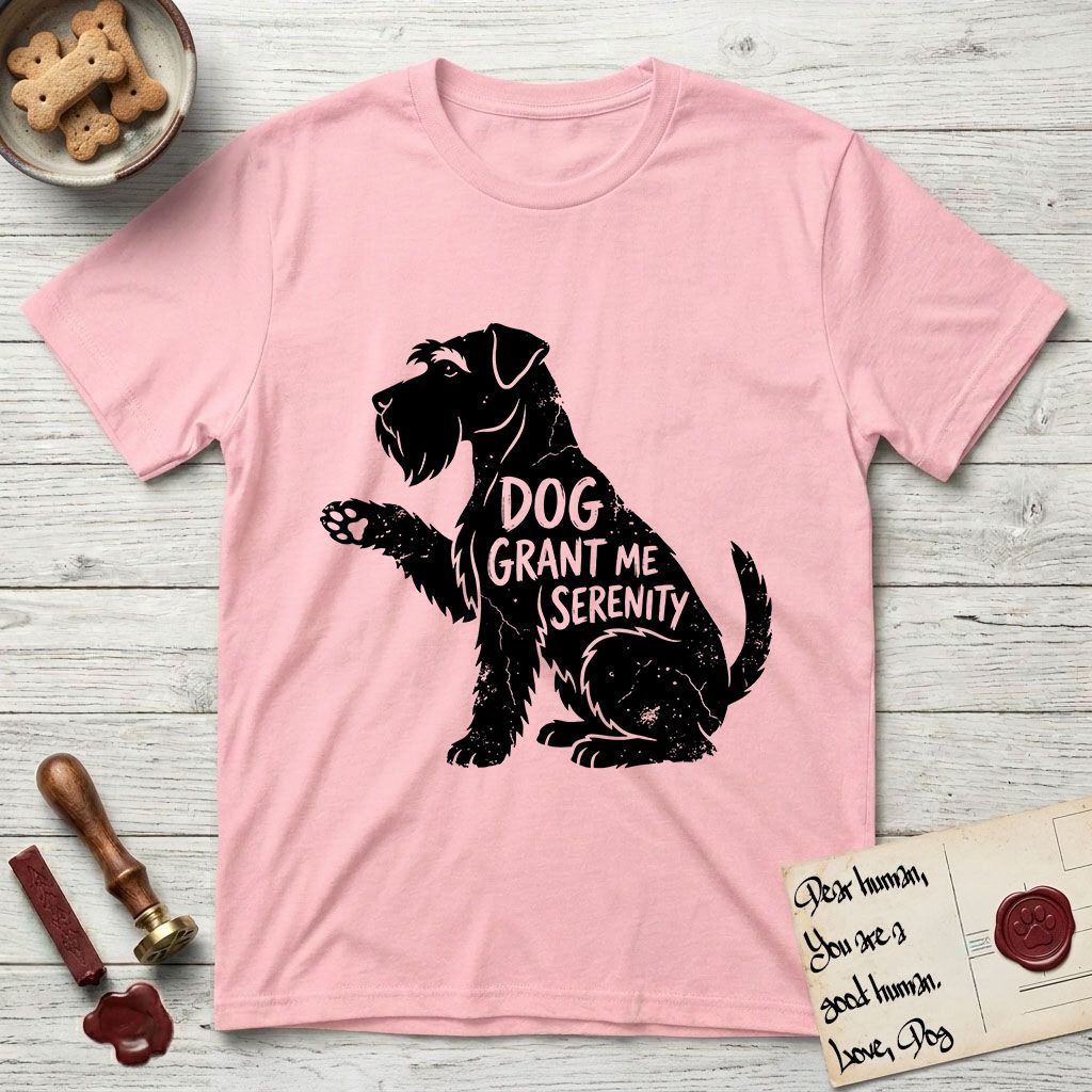 Serenity Schnauzer T-Shirt flat lay in Light Pink, featuring Distressed black screen print silhouette of a Schnauzer sitting in profile with one paw raised, a long beard and bushy eyebrows, the words DOG GRANT ME SERENITY showing through her body in the shirt color.