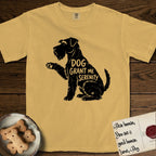 Serenity Schnauzer T-Shirt flat lay in Mustard, featuring Distressed black screen print silhouette of a Schnauzer sitting in profile with one paw raised, a long beard and bushy eyebrows, the words DOG GRANT ME SERENITY showing through her body in the shirt color.
