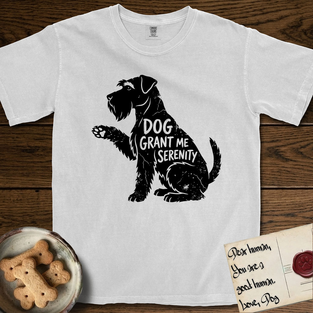 Serenity Schnauzer T-Shirt flat lay in White, featuring Distressed black screen print silhouette of a Schnauzer sitting in profile with one paw raised, a long beard and bushy eyebrows, the words DOG GRANT ME SERENITY showing through her body in the shirt color.