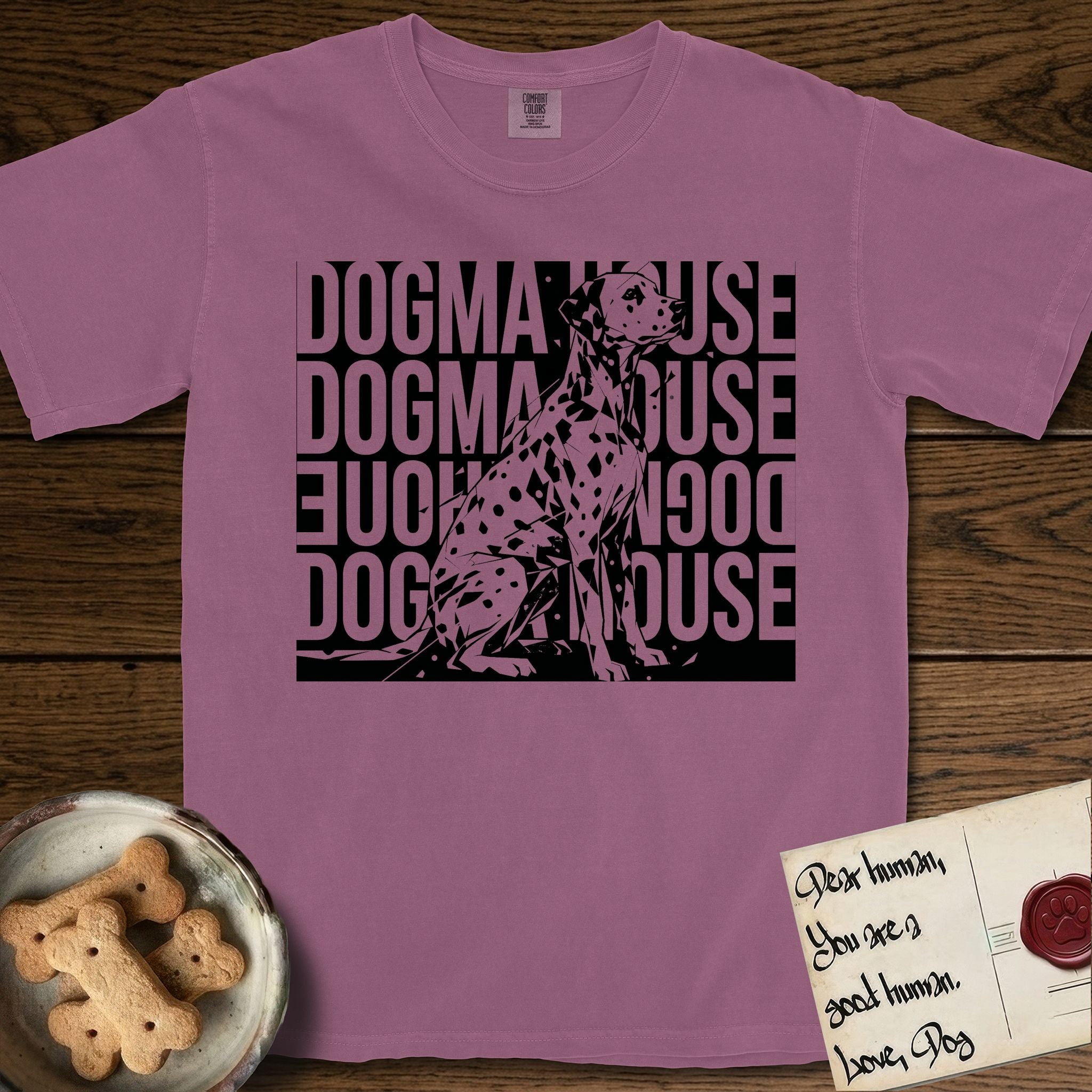 Dogma House Dalmatian T-Shirt flat lay in Berry, featuring a bold streetwear design with DOGMA HOUSE stacked four times in block letters and a geometric angular Dalmatian overlaid on the text.