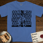 Dogma House Dalmatian T-Shirt flat lay in Mystic Blue, featuring a bold streetwear design with DOGMA HOUSE stacked four times in block letters and a geometric angular Dalmatian overlaid on the text.