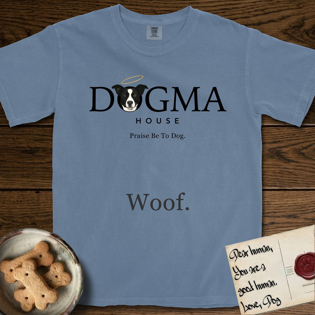 Dogma House Dark Logo T-Shirt flat lay in Blue Jean, featuring the Dogma House wordmark in dark ink with Lobo the mascot forming the O, a halo above him, and HOUSE below.
