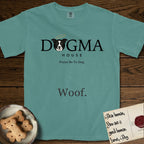 Dogma House Dark Logo T-Shirt flat lay in Blue Spruce, featuring the Dogma House wordmark in dark ink with Lobo the mascot forming the O, a halo above him, and HOUSE below.