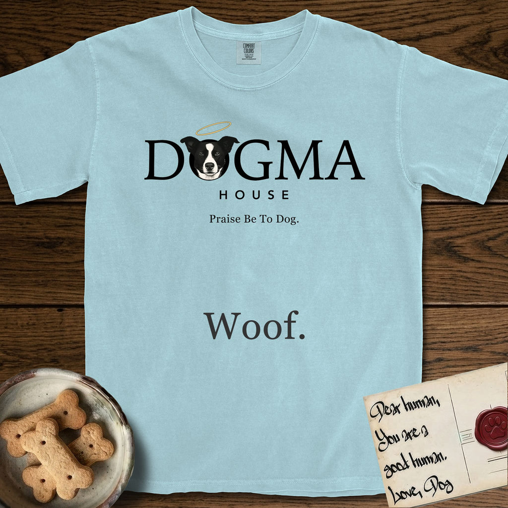 Dogma House Dark Logo T-Shirt flat lay in Chambray, featuring the Dogma House wordmark in dark ink with Lobo the mascot forming the O, a halo above him, and HOUSE below.