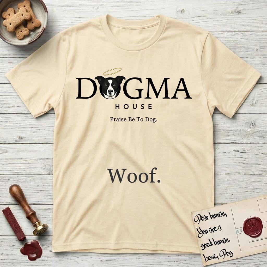 Dogma House Dark Logo T-Shirt flat lay in Natural, featuring the Dogma House wordmark in dark ink with Lobo the mascot forming the O, a halo above him, and HOUSE below.