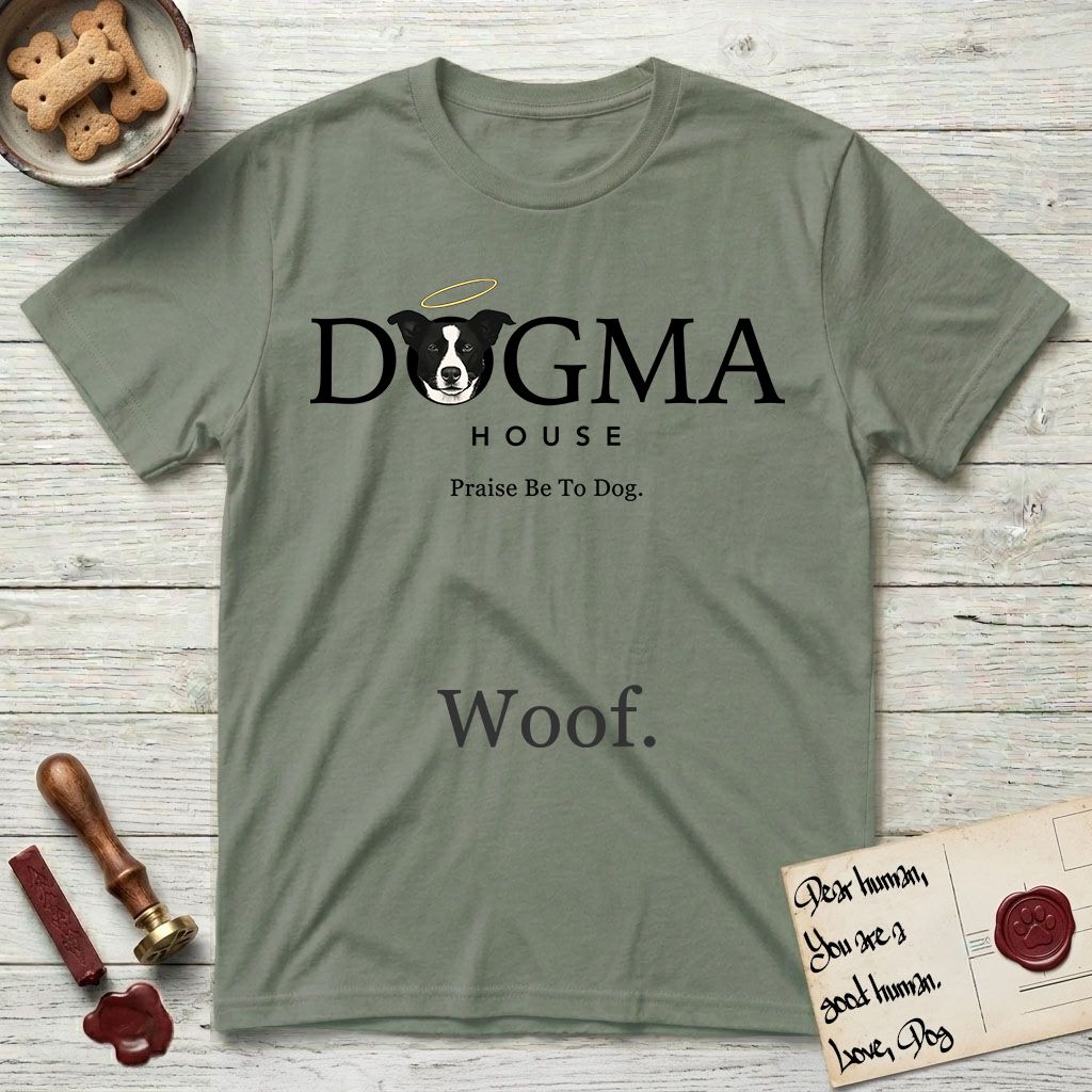 Dogma House Dark Logo T-Shirt flat lay in Sage, featuring the Dogma House wordmark in dark ink with Lobo the mascot forming the O, a halo above him, and HOUSE below.