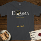 Dogma House Light Logo T-Shirt flat lay in Graphite, featuring the Dogma House wordmark in light ink with Lobo the mascot forming the O, a gold halo above him, and Woof below.