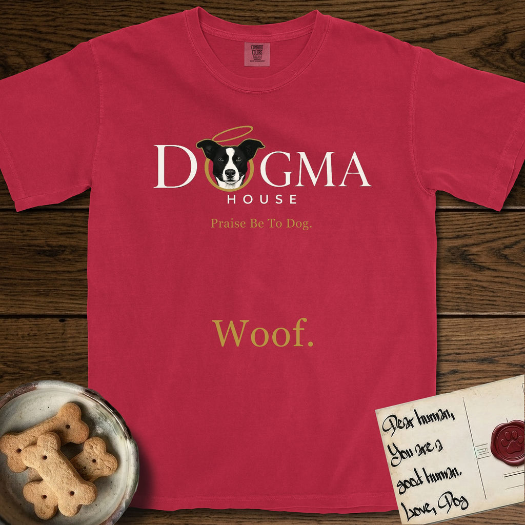 Dogma House Light Logo T-Shirt flat lay in Red, featuring the Dogma House wordmark in light ink with Lobo the mascot forming the O, a gold halo above him, and Woof below.