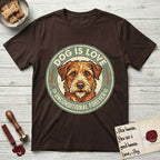 Dog is Love T-Shirt flat lay in Dark Chocolate, featuring a vintage distressed circular badge with a scruffy terrier on a sage-green ground, the words Dog Is Love and Unconditional Forever, and flanking paw prints.