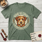 Dog is Love T-Shirt flat lay in Military Green, featuring a vintage distressed circular badge with a scruffy terrier on a sage-green ground, the words Dog Is Love and Unconditional Forever, and flanking paw prints.