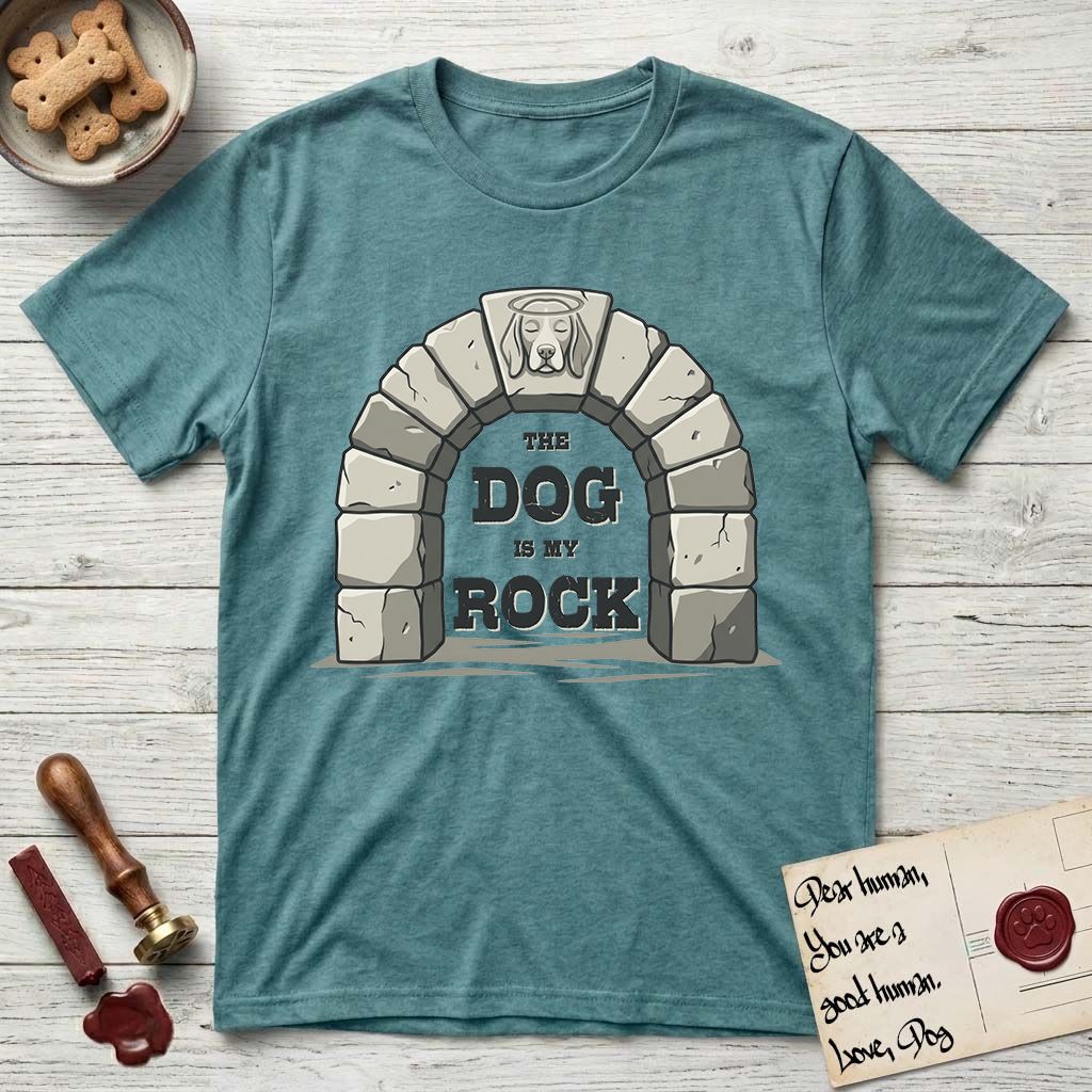 DIMR Beagle T-Shirt flat lay in Heather Galapagos Blue, featuring carved gray stone arch with a Beagle's face in shallow relief on the keystone and a halo above, with the words the Dog is my Rock.
