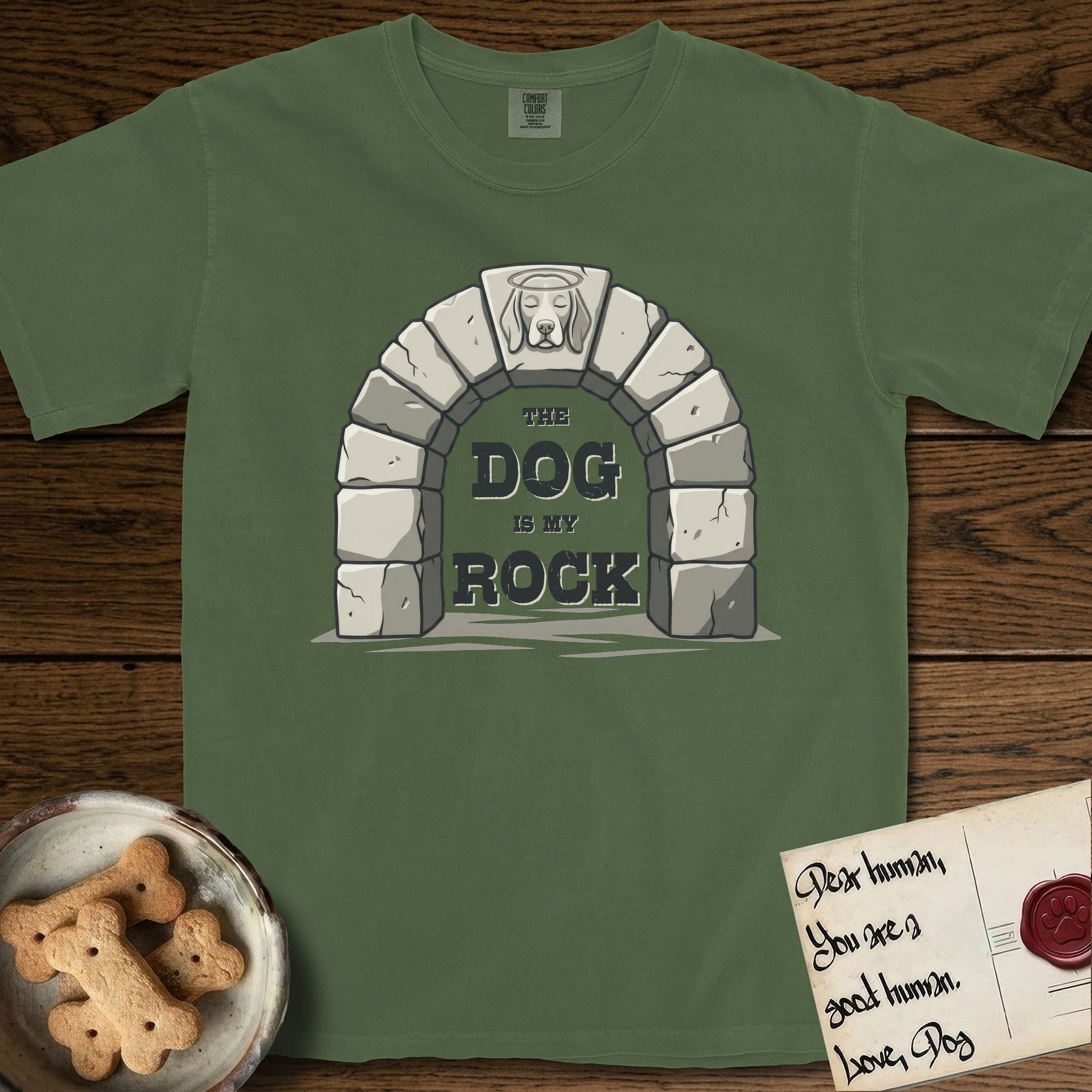 DIMR Beagle T-Shirt flat lay in Moss, featuring carved gray stone arch with a Beagle's face in shallow relief on the keystone and a halo above, with the words the Dog is my Rock.