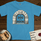 DIMR Beagle T-Shirt flat lay in Royal Caribe, featuring carved gray stone arch with a Beagle's face in shallow relief on the keystone and a halo above, with the words the Dog is my Rock.