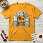 DIMR Bull Terrier T-Shirt flat lay in Gold, featuring carved gray stone arch with a Bull Terrier's face in shallow relief on the keystone and a halo above, with the words the Dog is my Rock.