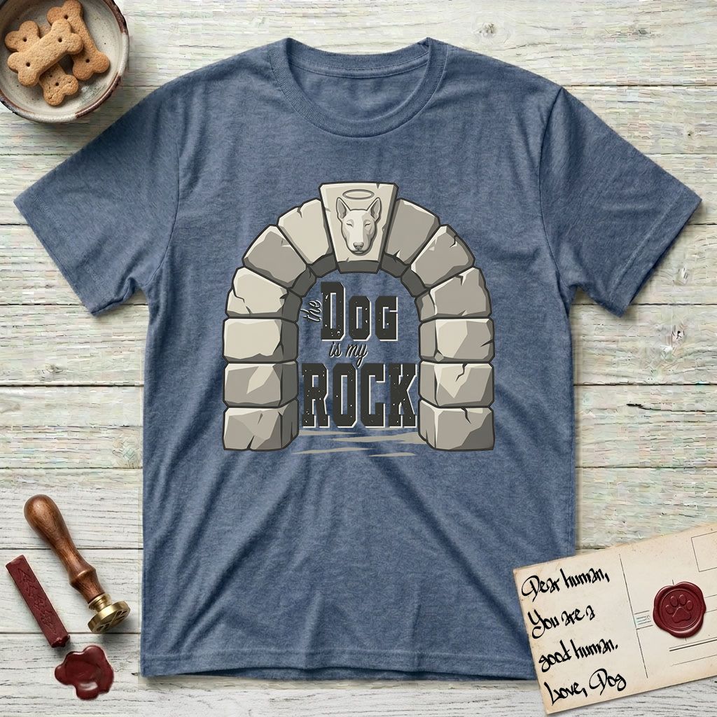 DIMR Bull Terrier T-Shirt flat lay in Heather Indigo, featuring carved gray stone arch with a Bull Terrier's face in shallow relief on the keystone and a halo above, with the words the Dog is my Rock.