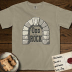 DIMR Bull Terrier T-Shirt flat lay in Khaki, featuring carved gray stone arch with a Bull Terrier's face in shallow relief on the keystone and a halo above, with the words the Dog is my Rock.